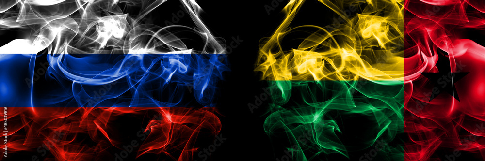 Obraz premium Russia, Russian vs Guinea Bissau flags. Smoke flag placed side by side isolated on black background