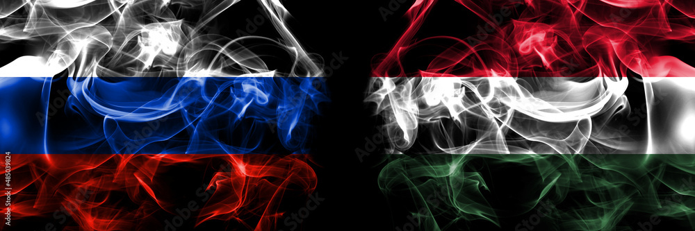 Russia, Russian vs Hungary, Hungarian flags. Smoke flag placed side by side isolated on black background