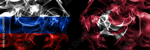 Russia, Russian vs Japan, Japanese, Hiroshima Prefecture flags. Smoke flag placed side by side isolated on black background photo