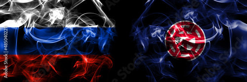 Russia, Russian vs Japan, Japanese, Nemuro, Hokkaido, Nemuro, Subprefecture flags. Smoke flag placed side by side isolated on black background