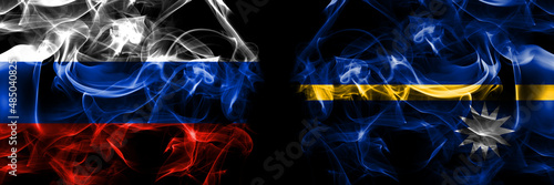 Russia, Russian vs Nauru, Nauruan flags. Smoke flag placed side by side isolated on black background