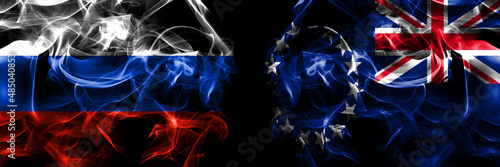 Russia, Russian vs New Zealand, Cook Islands flags. Smoke flag placed side by side isolated on black background