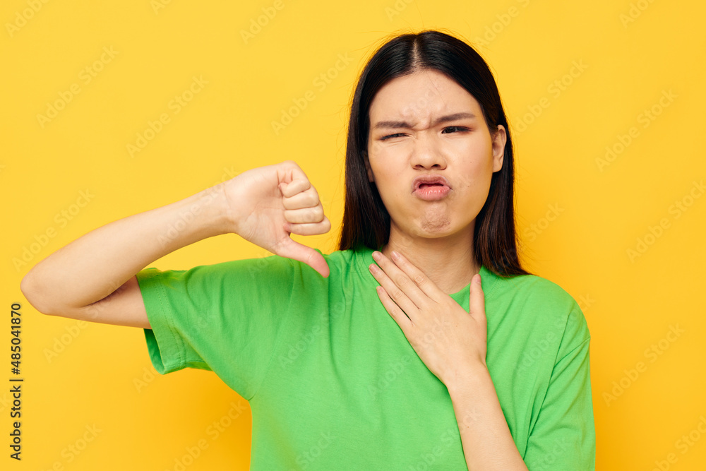 woman posing in green t-shirt emotions copy-space isolated background unaltered woman posing in green t-shirt emotions copy-space isolated background unaltered