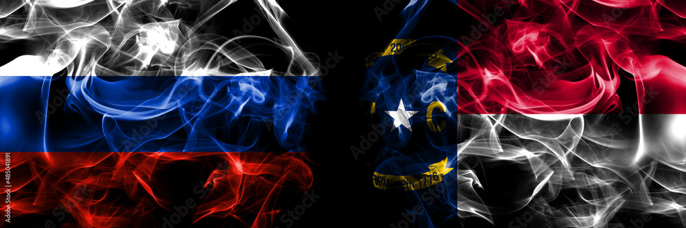 Russia, Russian vs United States of America, America, US, USA, American, North Carolina flags. Smoke flag placed side by side isolated on black background
