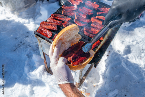 barbecue of  Turkish sucuk which tastes like highly spiced aged crumbled beef that is saturated with fat on outdoor activity. photo