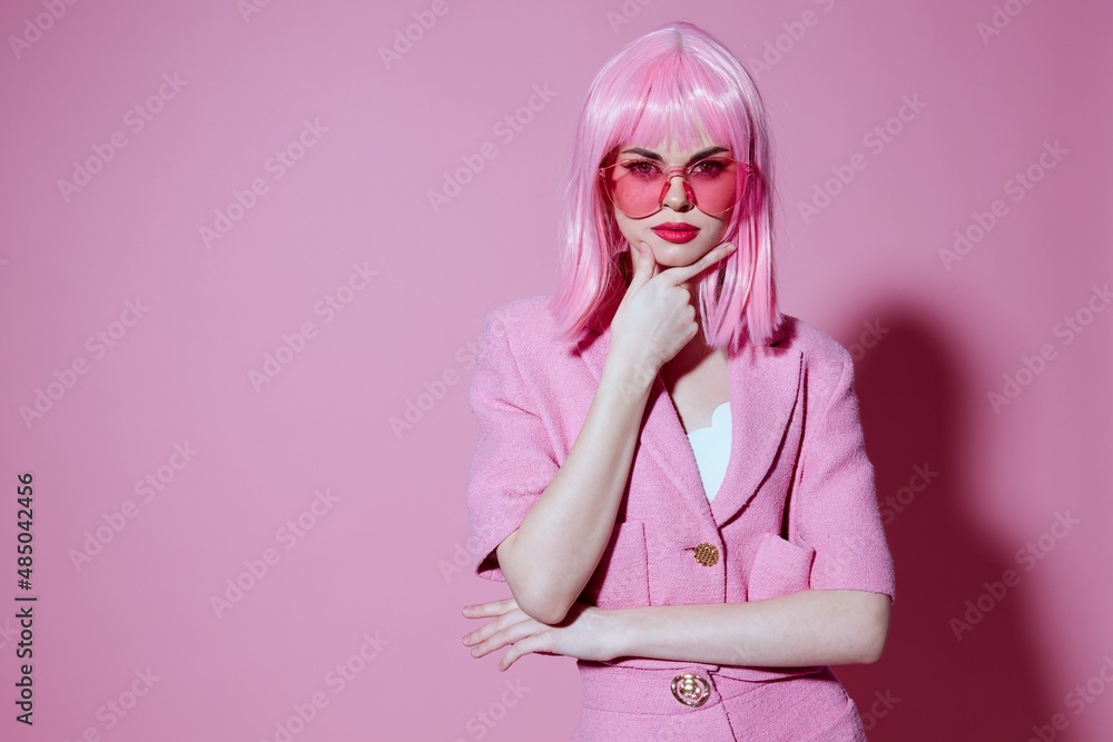 Portrait of a young woman gestures with his hands with a pink jacket Studio Model unaltered Portrait of a young woman gestures with his hands with a pink jacket Studio Model unaltered