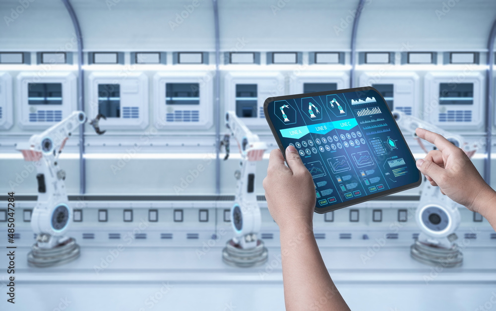 Technician control automation robot in factory Technician control automation robot in factory