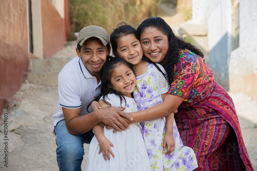 Photographie Portrait of a Latin family hugging in rural area - Happy Hispanic family in the