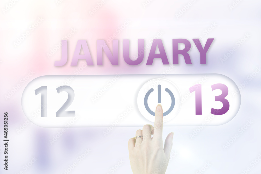 January 13rd. Day 13 of month, Calendar date.Hand finger switches pointing calendar date on sunlight office background. Winter month, day of the year concept. January 13rd. Day 13 of month, Calendar date.Hand finger switches pointing calendar date on sunlight office background. Winter month, day of the year concept.