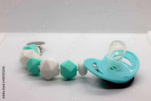 black baby pacifier on a white background