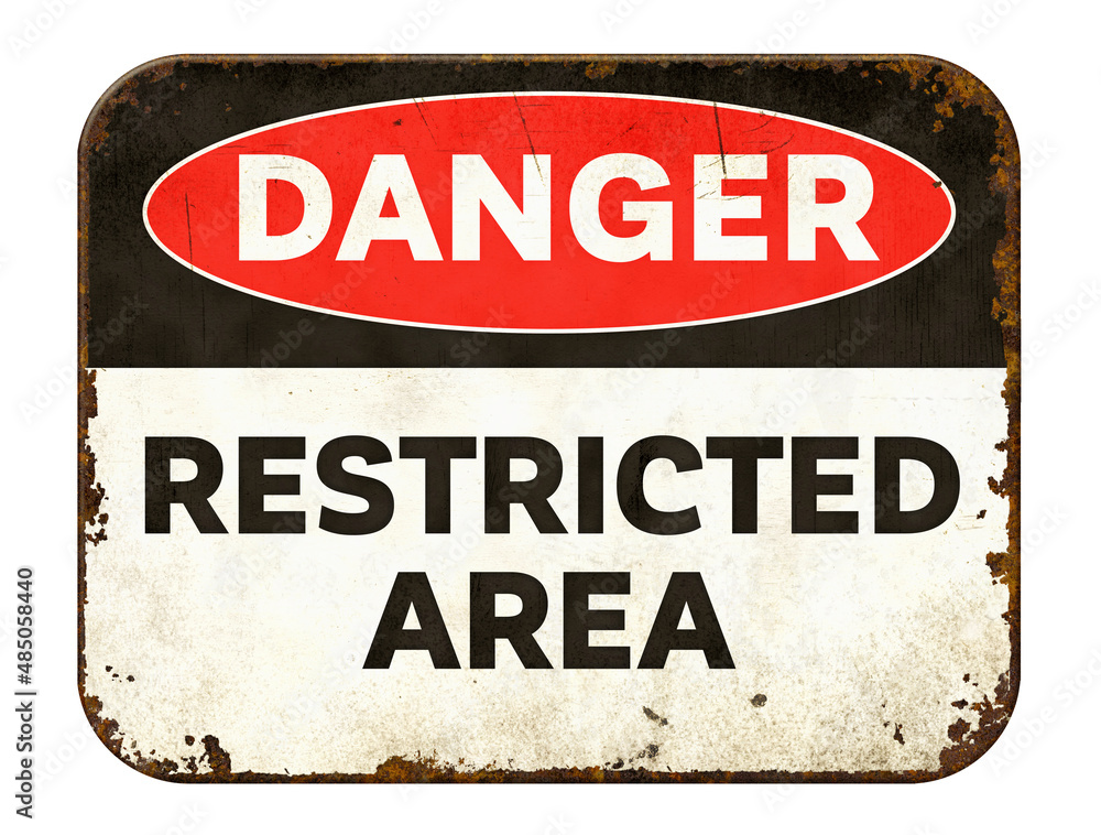 Naklejka premium Vintage tin danger sign on a white background - Restricted Area
