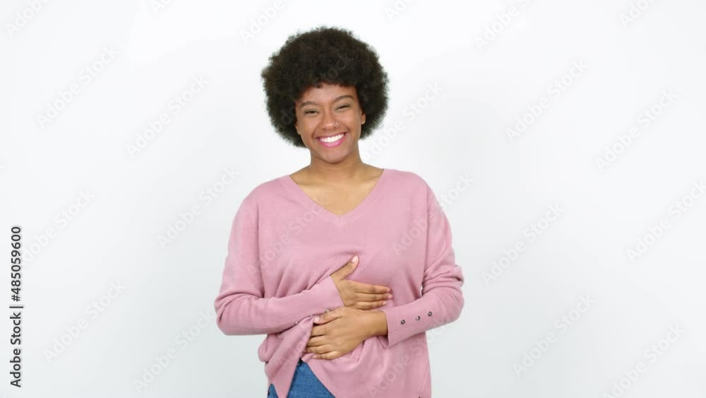 Young African American woman smiling a lot while covering mouth over isolated background Young African American woman smiling a lot while covering mouth over isolated background
