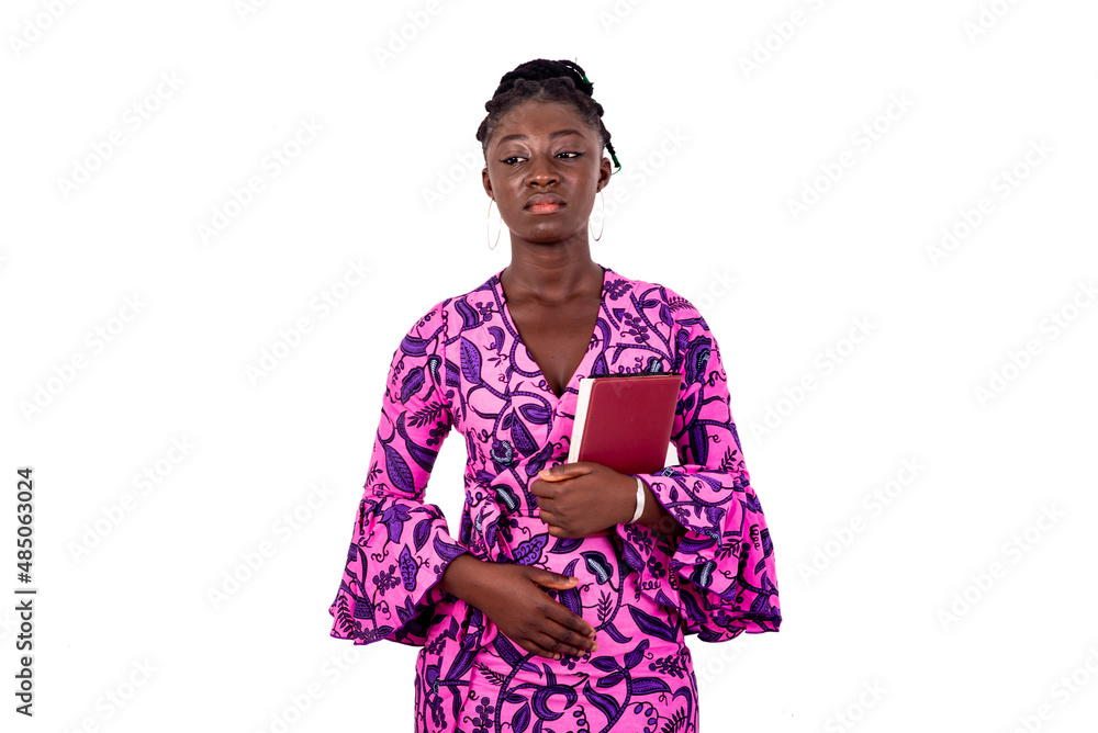 beautiful young confident business woman holding a notebook.
