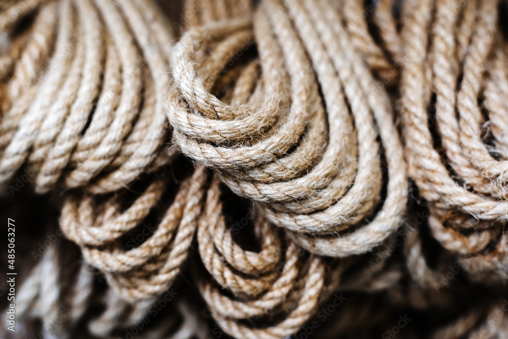 Coils of ropes made from natural materials. Manufacture and sale of household accessories. Close-up Coils of ropes made from natural materials. Manufacture and sale of household accessories. Close-up