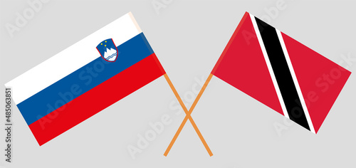 Crossed flags of Slovenia and Trinidad and Tobago. Official colors. Correct proportion