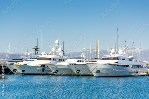 Beautiful yachts on the pier against the blue sky, Athens embankment © ArturSniezhyn