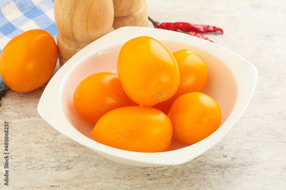 Sweet ripe yellow tomato in the bowl Sweet ripe yellow tomato in the bowl
