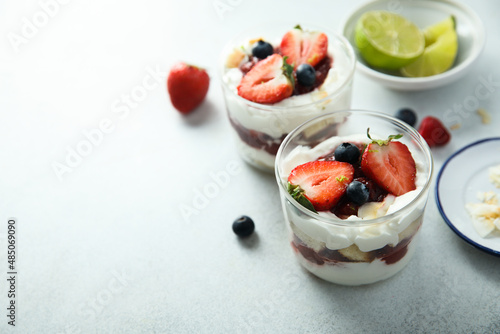 Homemade berry trifle with almond flakes