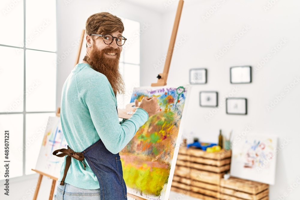 Young redhead man smiling confident drawing at art studio Young redhead man smiling confident drawing at art studio