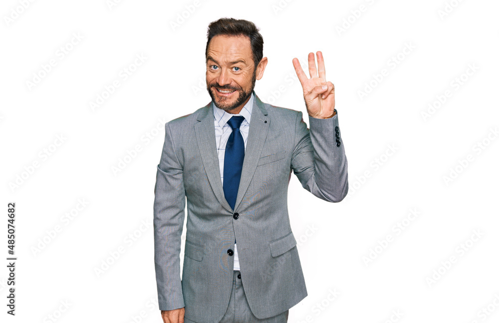 Middle age man wearing business clothes showing and pointing up with fingers number three while smiling confident and happy. Middle age man wearing business clothes showing and pointing up with fingers number three while smiling confident and happy.
