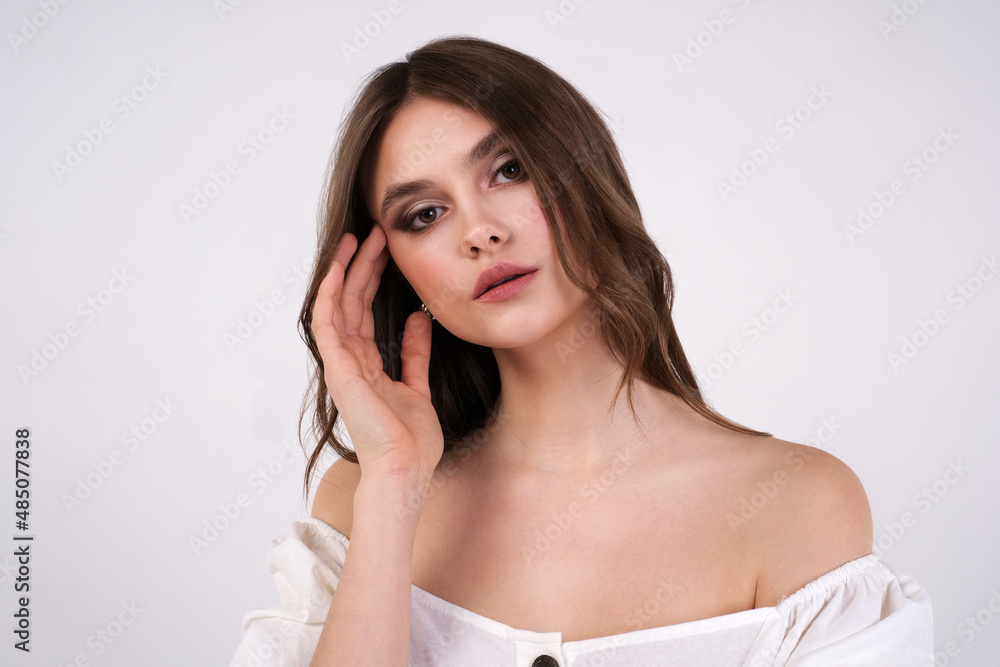 portrait of a young woman demonstrates makeup for a beauty salon portrait of a young woman demonstrates makeup for a beauty salon