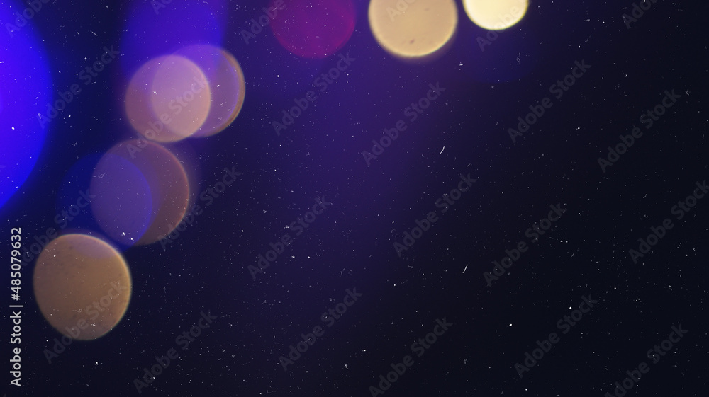 Fototapeta premium Dust and Film Grain Texture Blurred defocused bokeh overlay effect. Dark abstract background Copy space wallpaper or use screen mode to add beautiful texture to your photo.