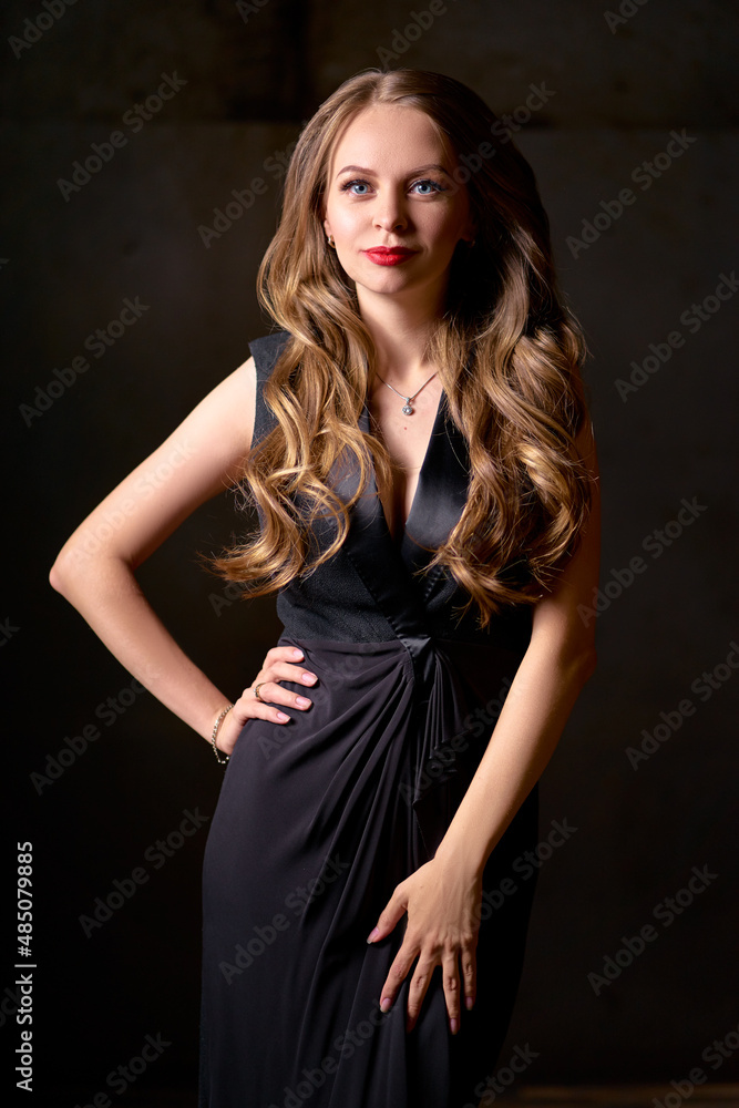 Close up studio Portrait of Beautiful smiling caucasian woman with long hair against black background Close up studio Portrait of Beautiful smiling caucasian woman with long hair against black background