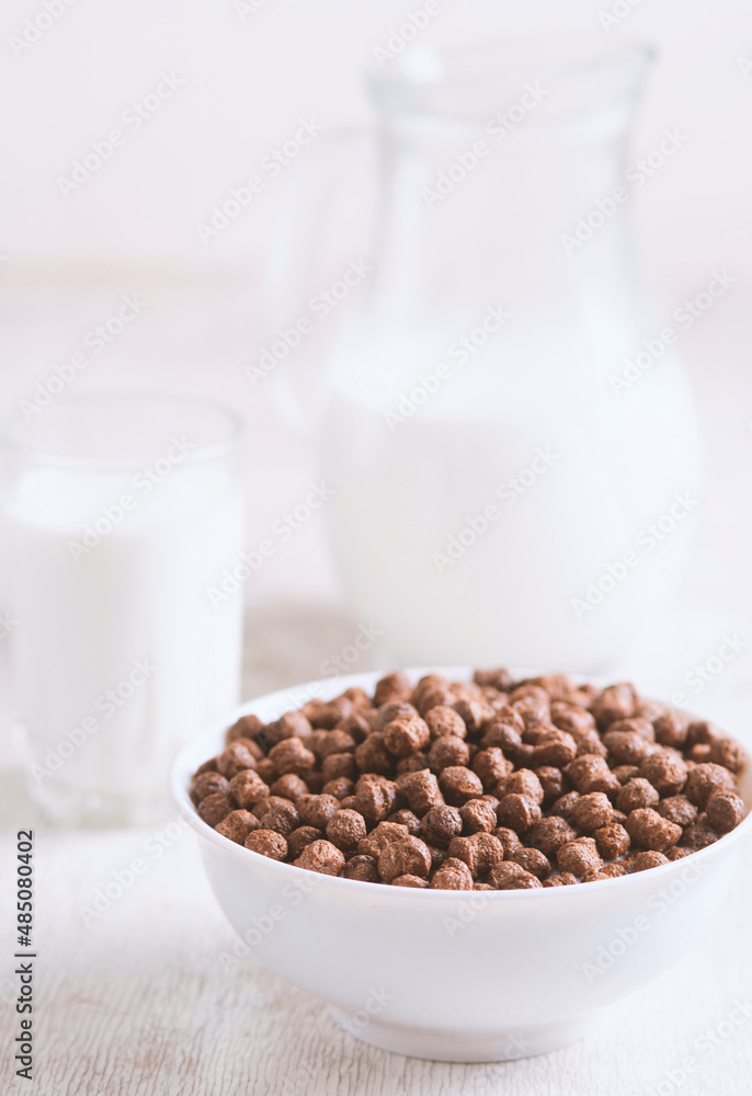 Breakfast: chocolate balls, fresh cows milk, selective focus Breakfast: chocolate balls, fresh cows milk, selective focus