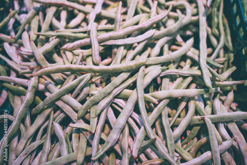 Green asparagus beans. Textured background.