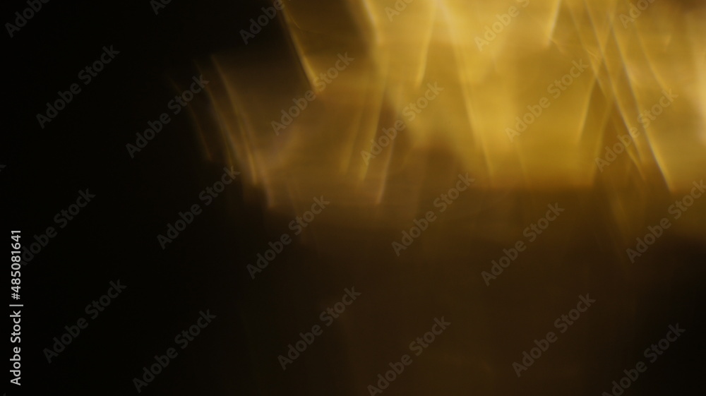 Golden bokeh crystal abstract light rays background, shiny flare texture photo overlay optical lens prism reflection. Use screen overlay mode. Golden bokeh crystal abstract light rays background, shiny flare texture photo overlay optical lens prism reflection. Use screen overlay mode.