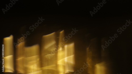 Golden bokeh crystal abstract light rays background  shiny flare texture photo overlay optical lens prism reflection. Use screen overlay mode.