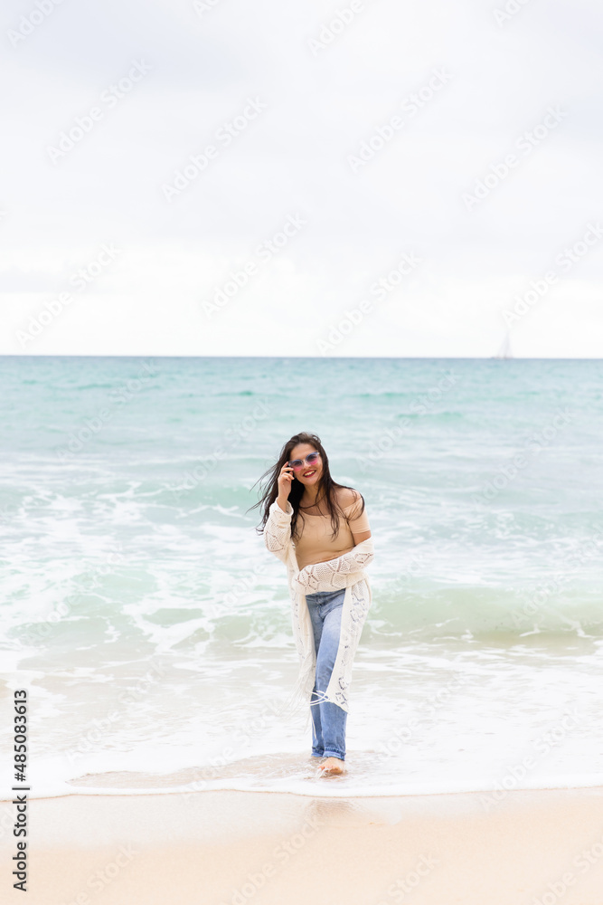 young beautiful girl having fun on the beach in Portugal against the backdrop of the Atlantic Ocean young beautiful girl having fun on the beach in Portugal against the backdrop of the Atlantic Ocean