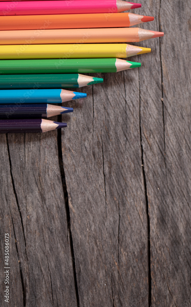 Fototapeta premium pencils on wooden background