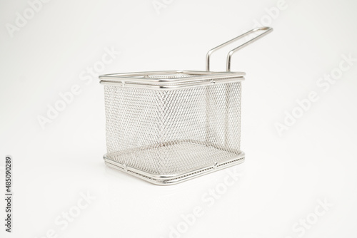stainless steel basket for frying food on a white background