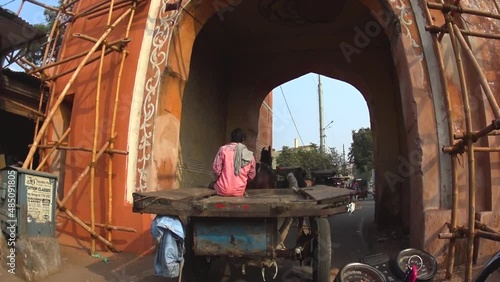 pov clip of auto rickshaw following horse carriage through the streets of Jaipur, India