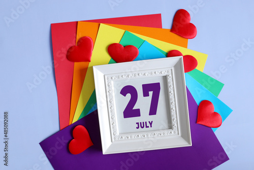 day of the month 27 July calendar . Calendar date in a white frame on a rainbow background