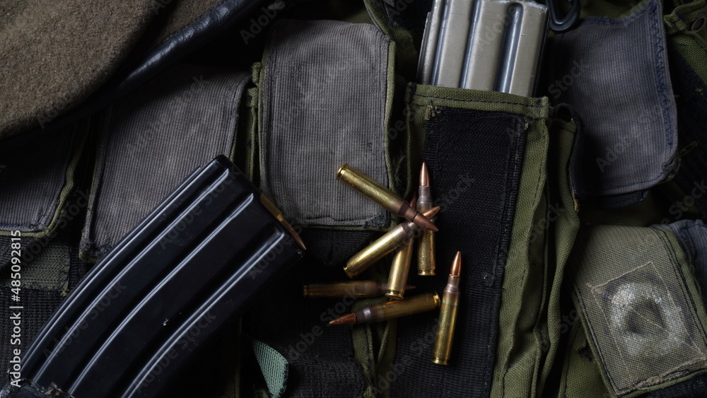 Photo of 5.56mm ammunition,  rifle ammunition in magazines, on armor vest