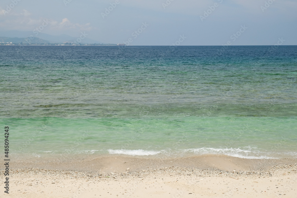 Tropical exotic paradise view of Cristo Rei Beach in Dili, Timor Leste.