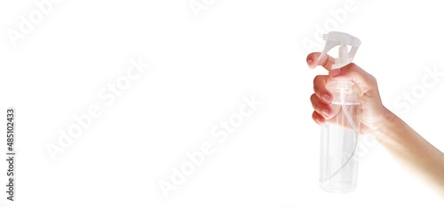 Close-up view hand holding a spray bottle. Homemade disinfectant. White background with empty space