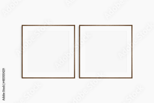 Frame mockup 1 1 square. Set of two thin dark walnut wood frames. Clean  modern  minimalist  bright gallery wall mockup  set of 2 square frames with a mat opening.