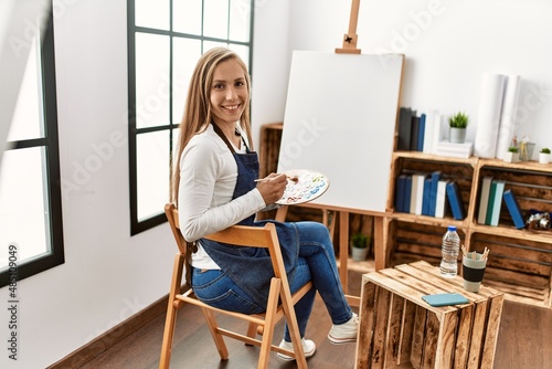 Young caucasian woman smiling confident drawing at art studio