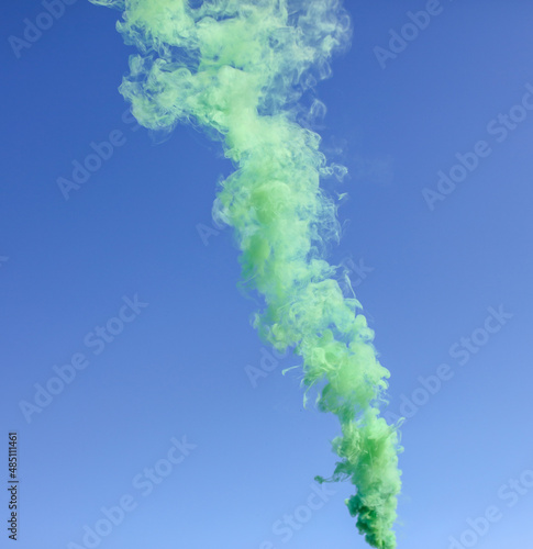 Green smoke on a blue background.