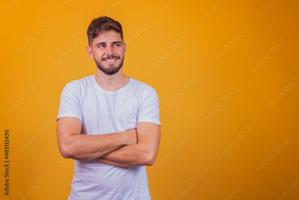 Young handsome boy smiling looking at camera with arms crossed. Young handsome boy smiling looking at camera with arms crossed.