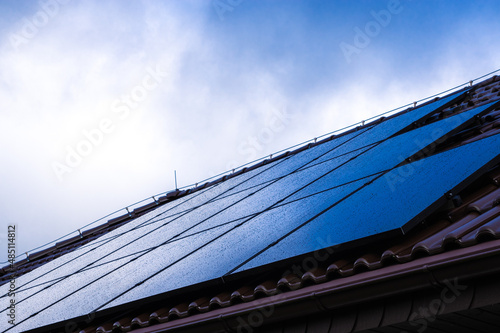 Solar panels on the roof on a rainy cloudy day