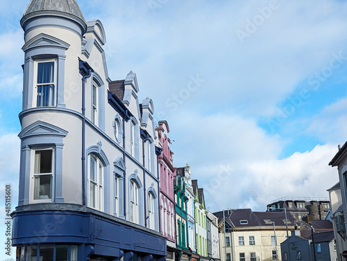 A very thin building at the junction of two streets in Caernarfon town centre Wales, UK photo