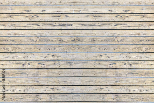 The texture of the wall of a wooden house  lined with clapboard