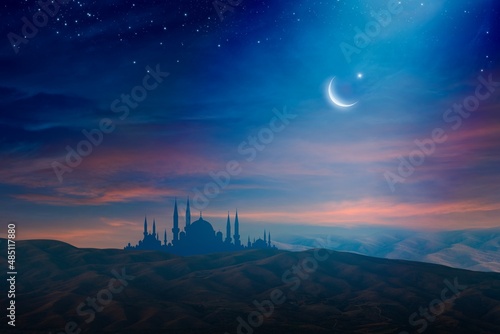 Ramadan background with crescent, stars and glowing clouds above mosque on mountains. Month of Ramadan is that in which was revealed Quran.