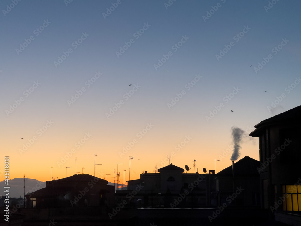 Naklejka premium Sunrise over apartments in Rome, Italy