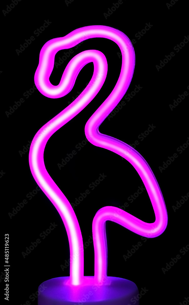 Neon pink flamingo isolated on black background. Stylish LED lamp made of flexible neon. Trendy summer silhouette. Neon pink flamingo isolated on black background. Stylish LED lamp made of flexible neon. Trendy summer silhouette.