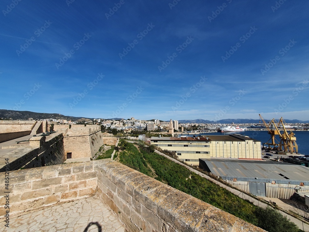 Ramparts and defenses of Castel Sant Carles Military Museum, Mallorca, Balearic Islands, Spain, in the background the city of Palma